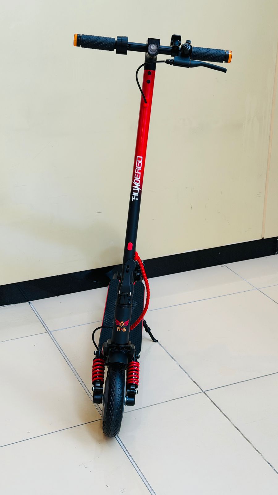 A12 electric scooter with strong brakes, sturdy build and comfortable riding design.