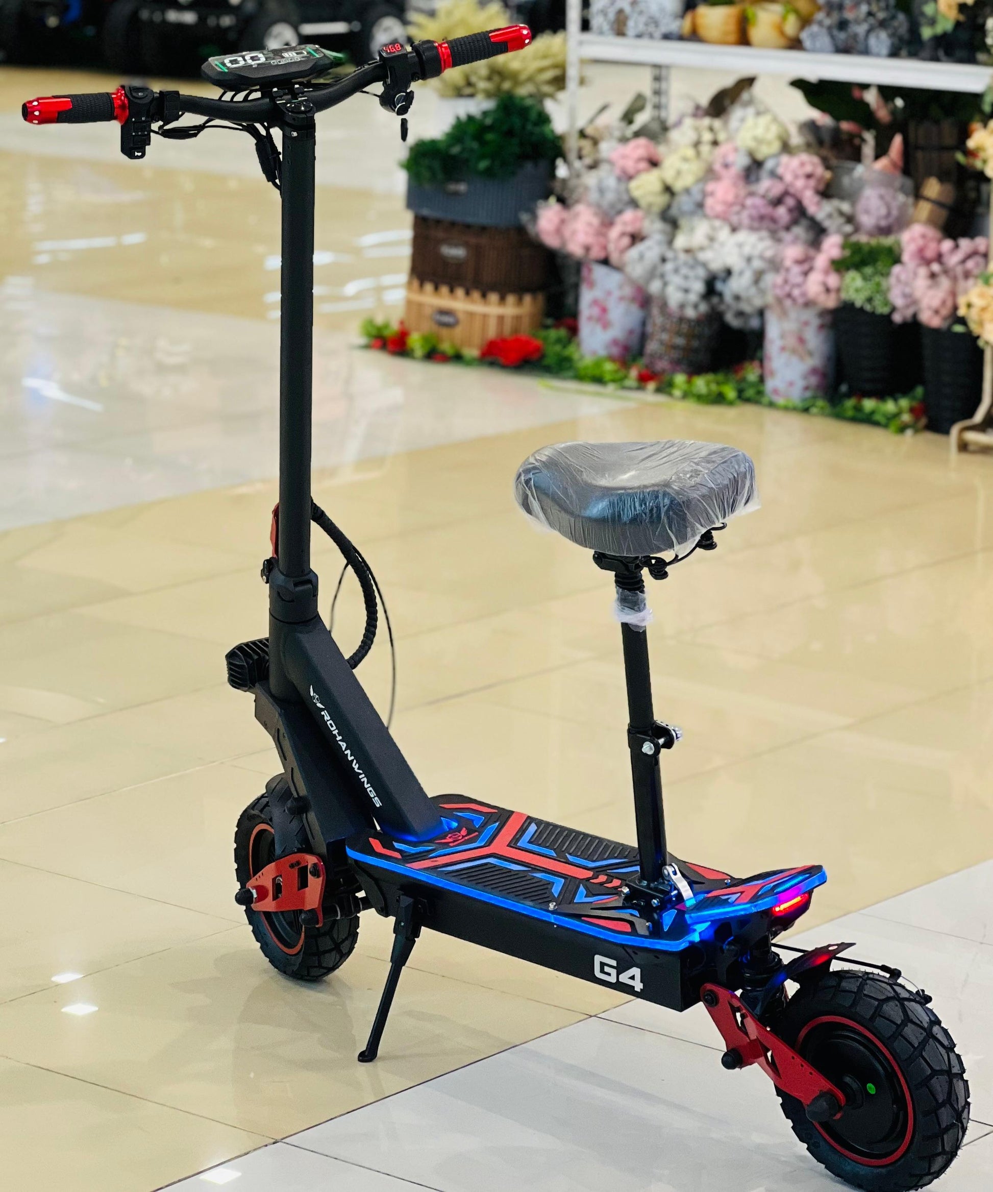 Side view of the GRL G4 e-scooter showcasing modern styling and long-range battery.
