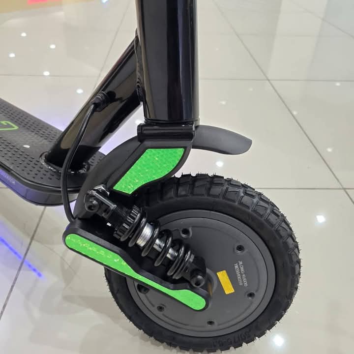 Kugoo Pro 4 electric scooter featuring green accents, durable frame, powerful motor, and stylish design for city commuting.