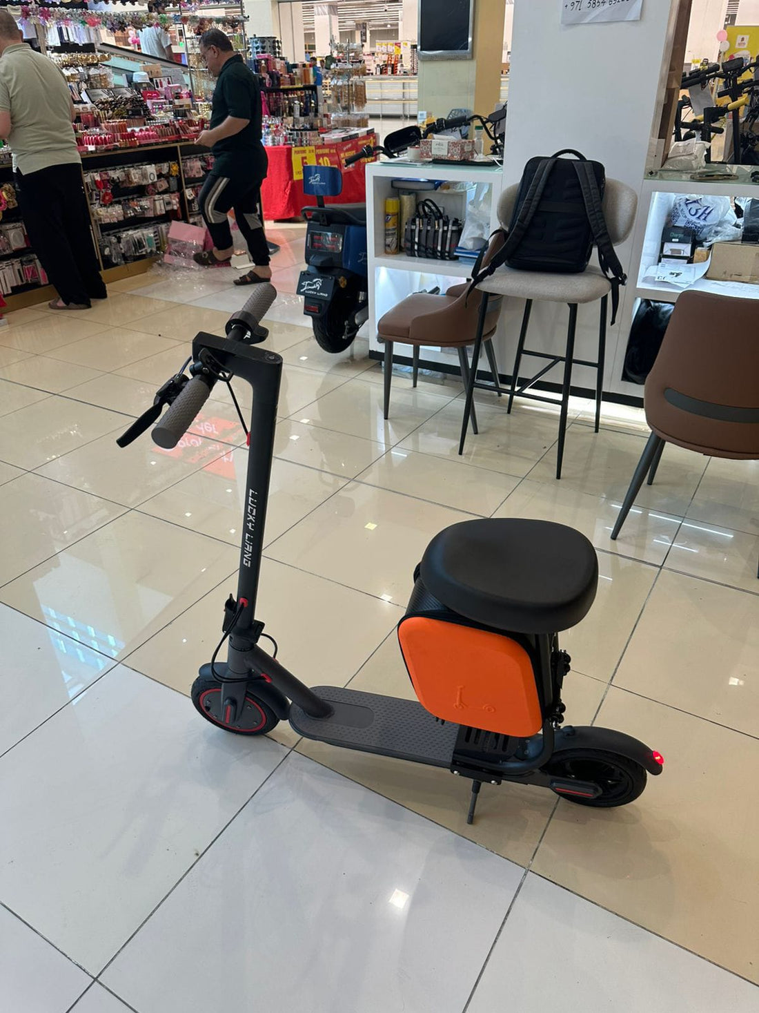 Lucky Liang M365 Plus electric scooter with seat, powerful motor and stable design for city rides.