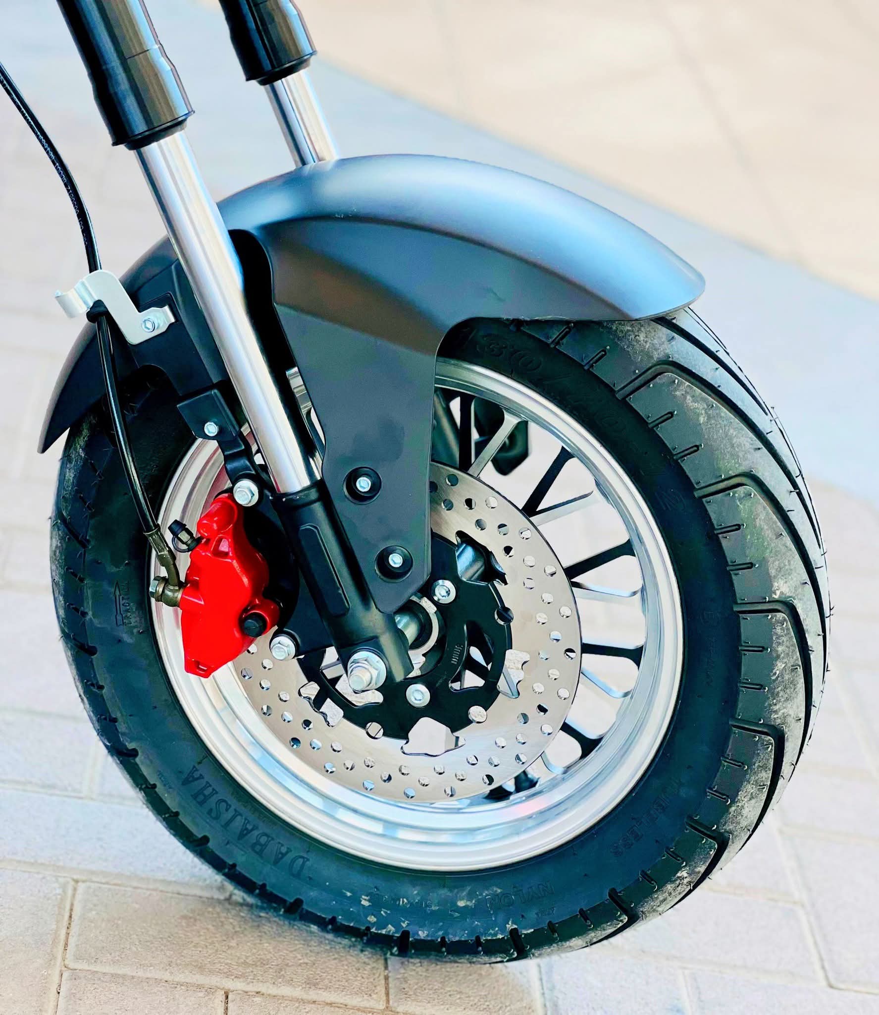 X-15 electric motorcycle showcasing long-range battery and sporty design.