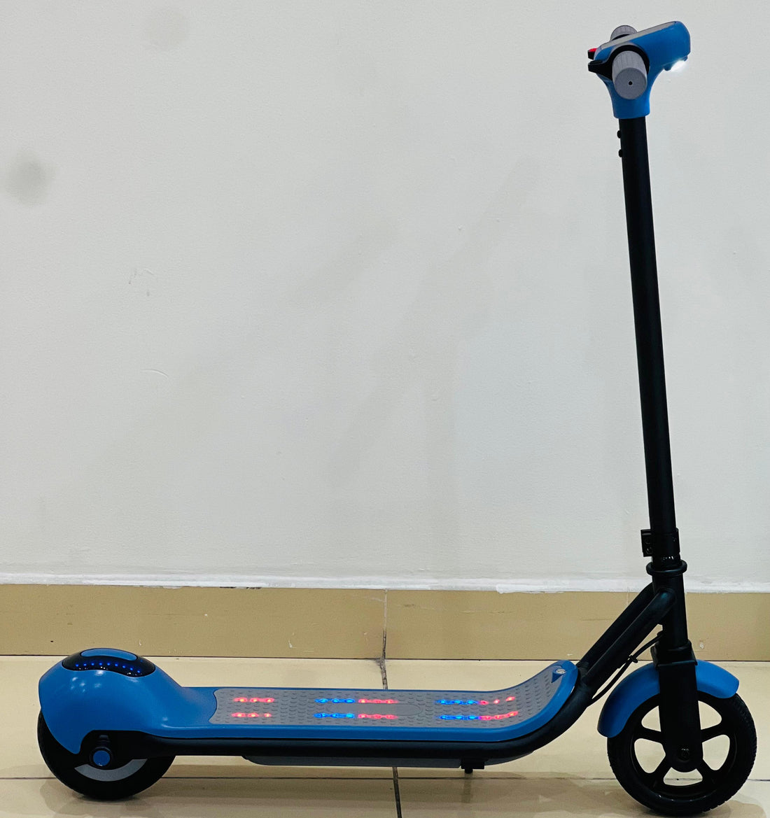 Child riding the Kids Electric Scooter performing smooth drifts outdoors.