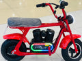 Child balancing confidently while riding a lightweight mini electric bike outdoors.